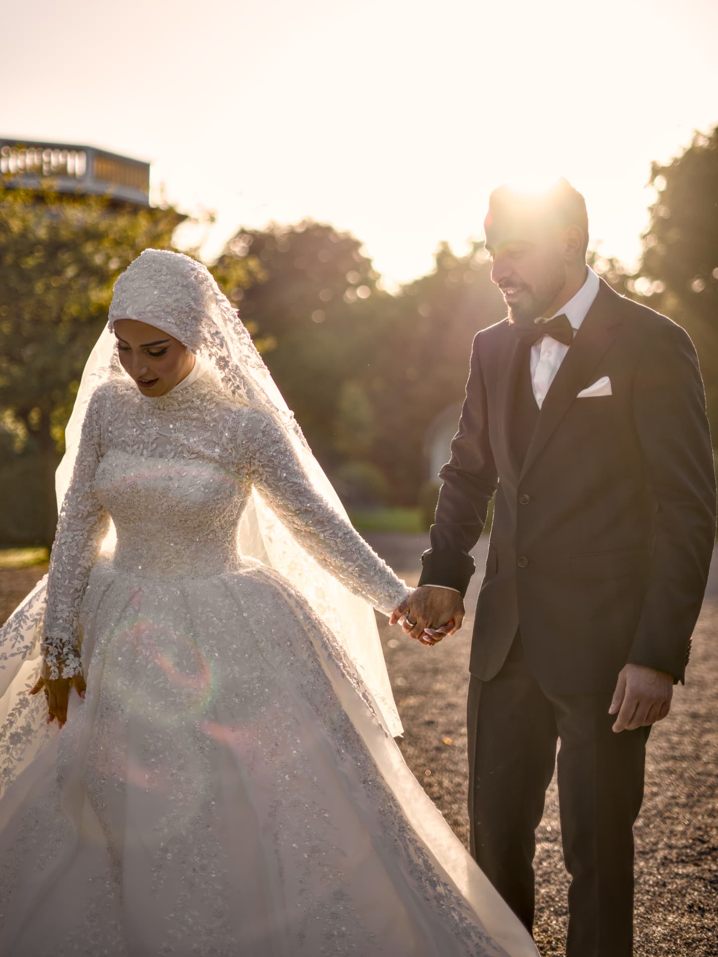 Mohamad & Marwa walking hand in hand in golden light