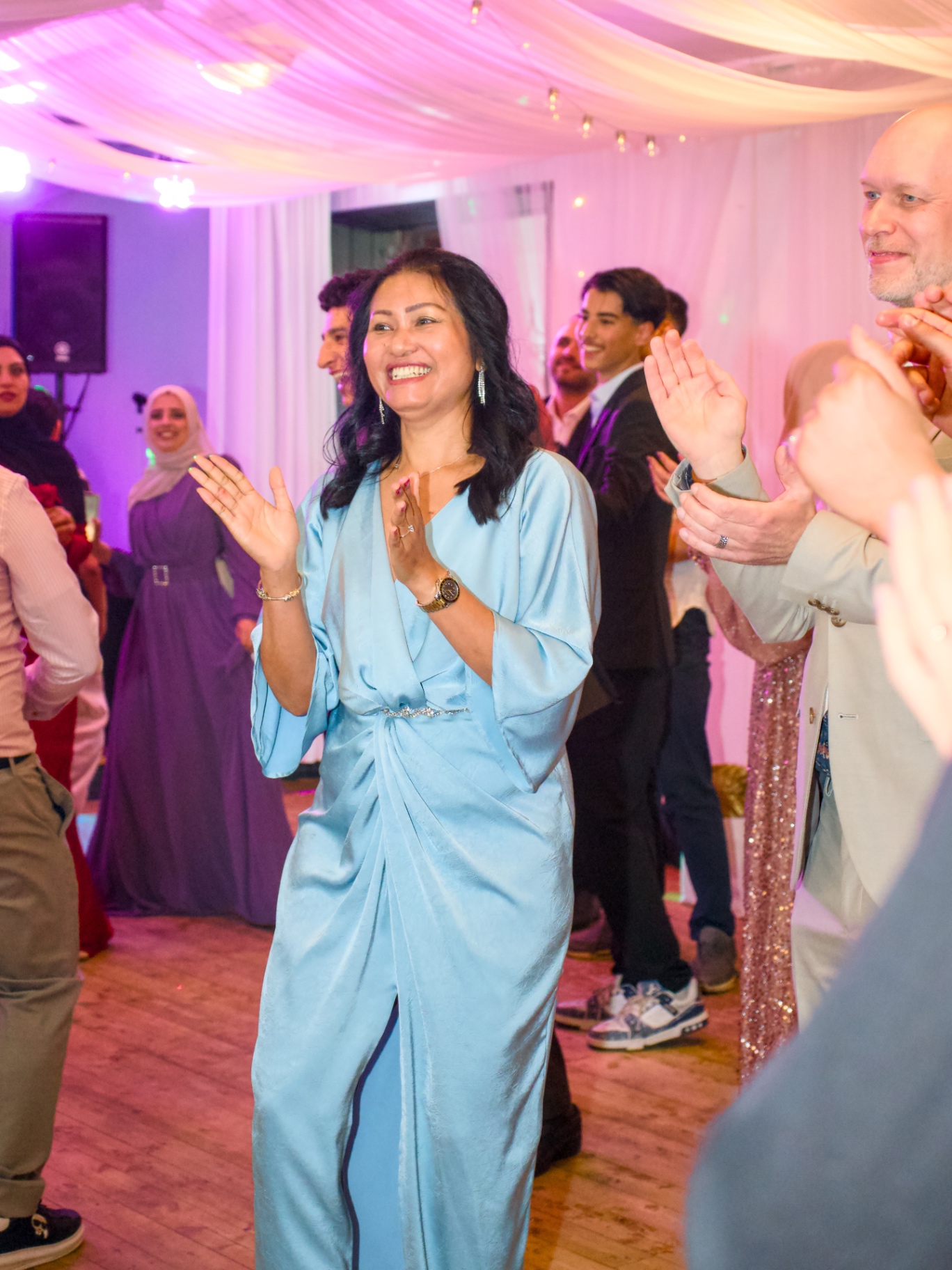 Guests celebrating and clapping